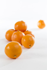 Bright Orange Clementines on a bright background