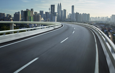 Highway overpass motion blur with city background .