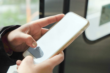 Close up image of women text messaging on her phone