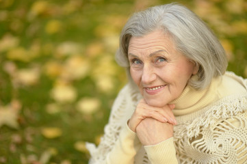 senior woman in  autumn park