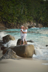 elderly couple dancing at tropical resort