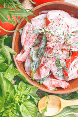 fresh salad with tomatoes and arugula in the sour cream
