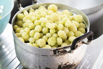 Star gooseberry in pot after wash with selective focus.