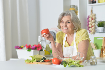 Senior woman cooking in kitchen