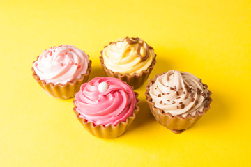 Chocolate cupcakes with yellow backgroud