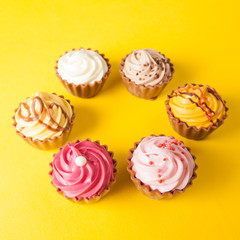 Chocolate cupcakes with yellow backgroud