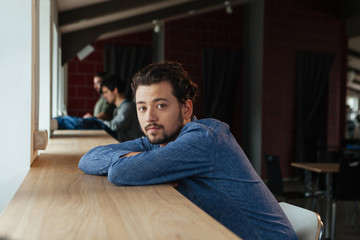 Fototapeta premium Man sitting at the table in office