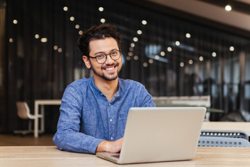 Man using laptop computer in office