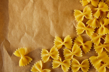 Beautiful background made of pasta ribbons on parchment paper with space for your text