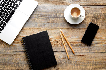 Working place with laptop on wooden table
