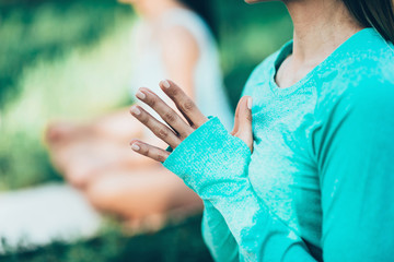Meditating after outdoor yoga class