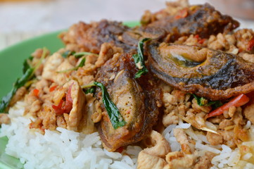 stir-fried black preserved egg and chop pork with basil leaf