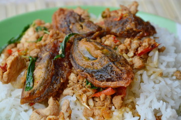 stir-fried black preserved egg and minced pork with basil leaf