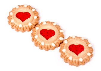 three cookies with marmalade heart isolated on white background