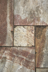 Detail of stone tiles texture outdoors with a geometric composition