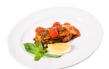 Grilled dorado covered with baked vegetables.