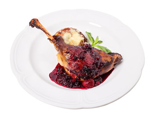 Delicious duck leg confit with red sauce.