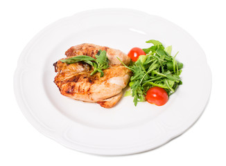 Grilled chicken fillet with tomatoes cherry.
