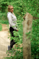 Woman on a bridge in forest