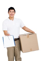 Delivery man with cardboard box and clipboard