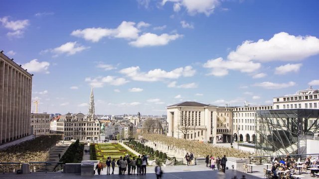 4K time lapse showing walking people on a square and in a park with magnificent views of the historic center of Brussels