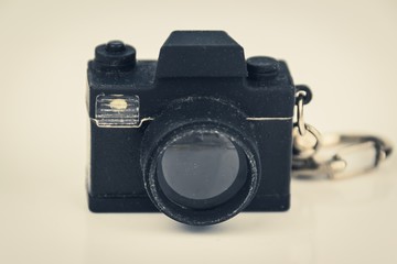 miniature photo camera toy, photography concept, vintage filter