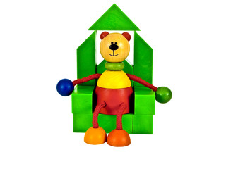 Wooden statuette sitting on the throne face view