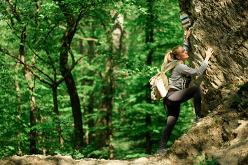 Young woman rock climbing