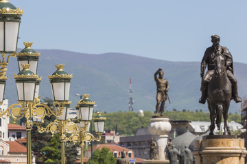 Fototapeta premium Square Makedonia, the capital's main square, with people passing by and Alexander the Great statue