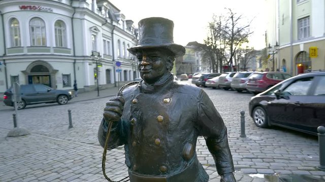 A statue of the chimney sweeper in the middle of the street
