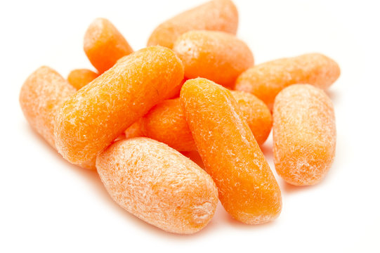 A small peeled carrots on a white background