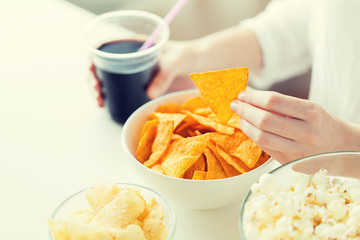 close up of woman with junk food and cola cup