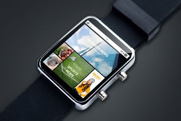 close up of smart watch with news pages on screen
