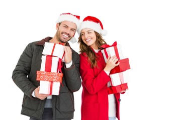 Happy young couple holding gifts