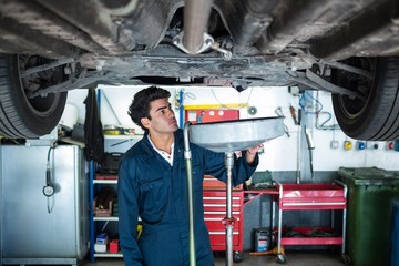 Mechanic servicing a car