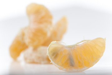 Closeup on Orange Clementines in Bright Studio