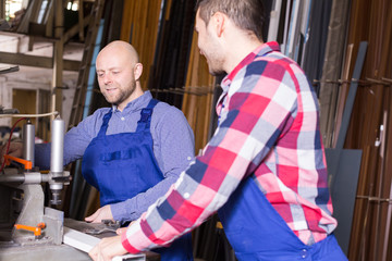 workers near milling machine