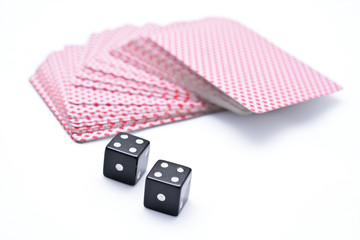 two black dice and cards