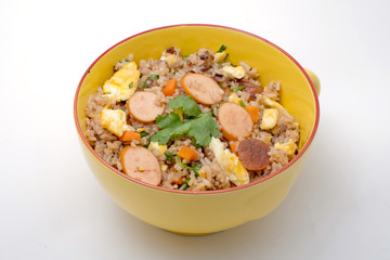 Fried rice with sausage and vegetables on white background