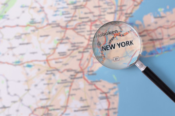 Consultation with magnifying glass map of New York