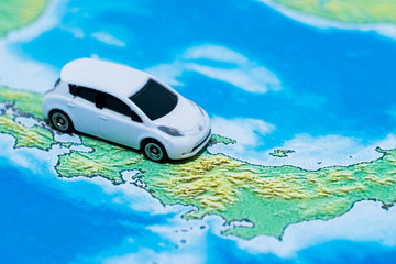 Image of travel.  Toy car on japanese map