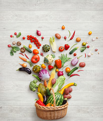 Healthy food background.  Studio photography of different vegetables on white wooden table. Top view, high-res product.