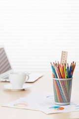 Fototapeta premium Office with with laptop, pencils and coffee