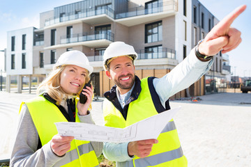 Worker and enginner checking last details before delivery