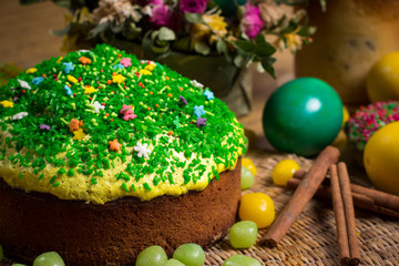 Obraz na płótnie Canvas Easter celebrating cake, color eggs, straw backgrounds, food holidays photography