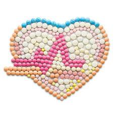 Drug beat / Creative medicine and healthcare concept made of drugs and pills, isolated on white. ECG, a human heart with a heartbeat line.