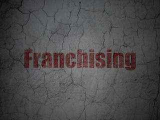 Business concept: Franchising on grunge wall background