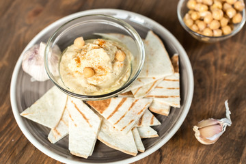 Healthy Homemade Creamy Hummus with Olive Oil and  Chips