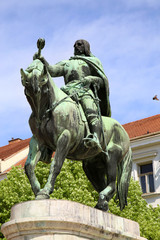 Fototapeta na wymiar A statue of Janos Hunyadi on Szechenyi Square in Pecs, Hungary