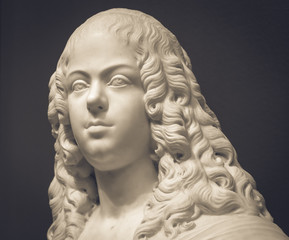 Fototapeta na wymiar White marble head of young woman